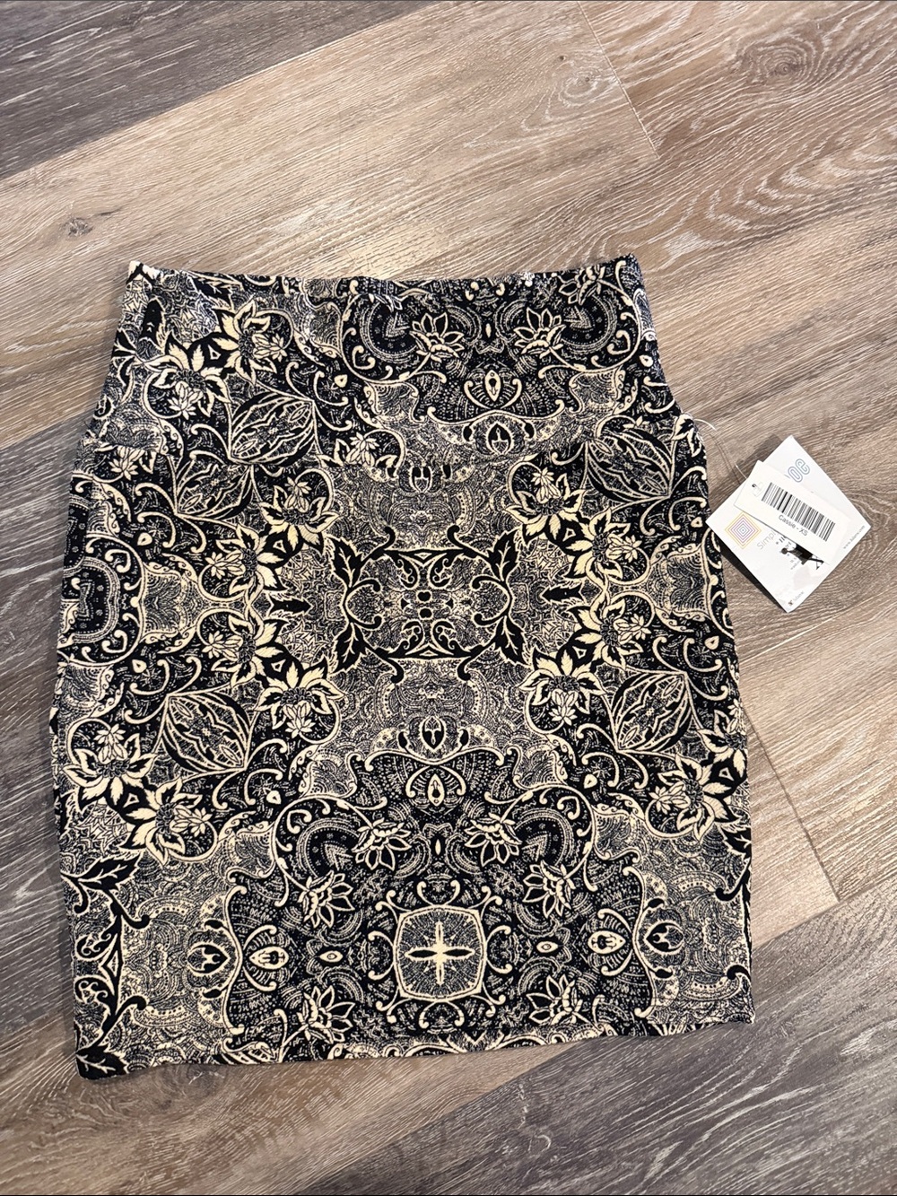 LuLaRoe Black and Cream Printed Mini Skirt